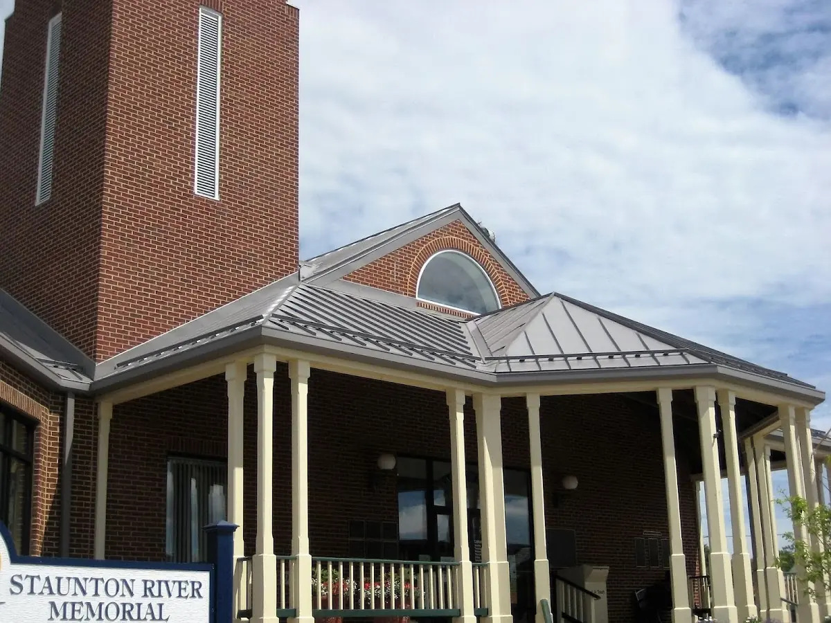 Skilled roofing craftsmen working on a residential roof in Winterville
